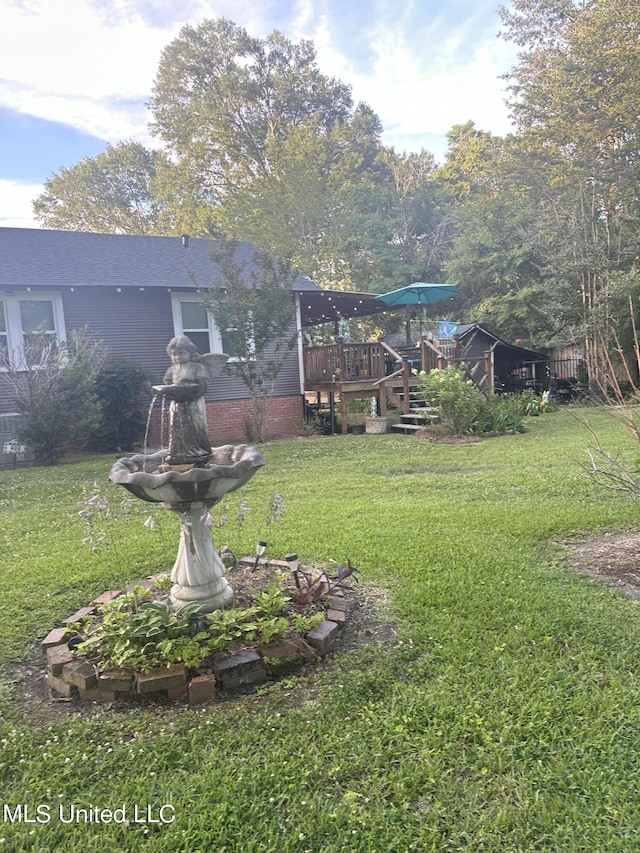 view of yard featuring a deck