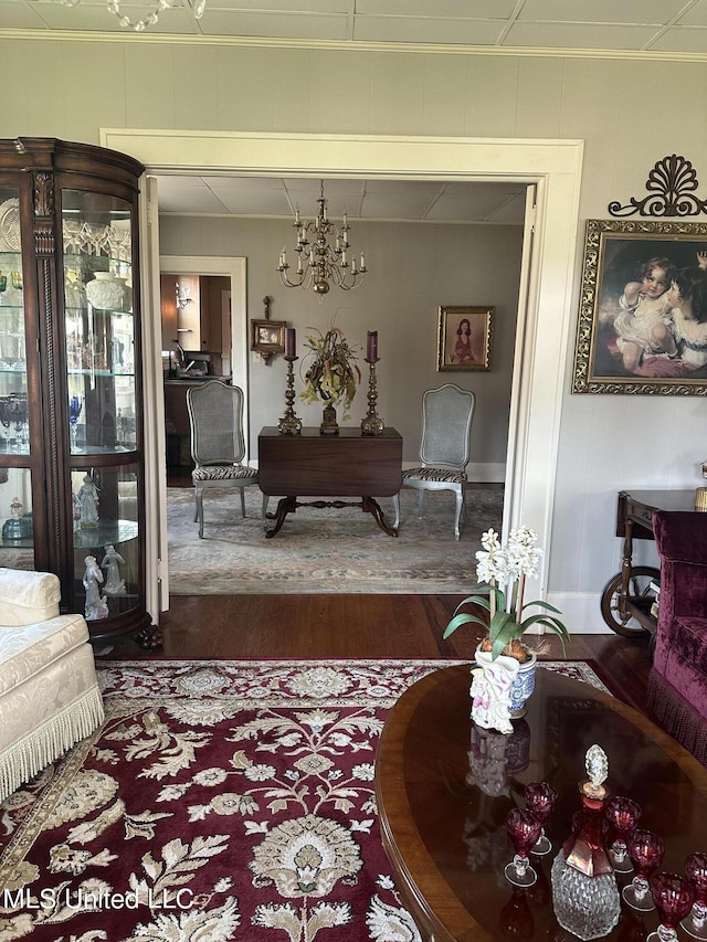 living room with an inviting chandelier and dark hardwood / wood-style floors