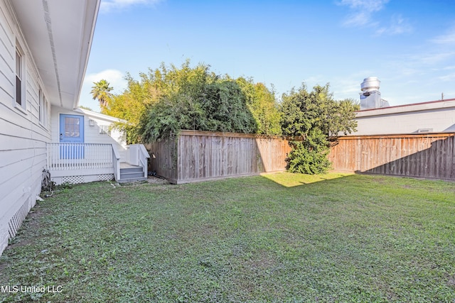 view of yard with a wooden deck