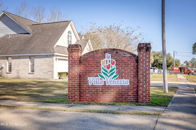 view of community sign