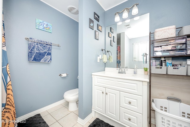 bathroom featuring tile patterned floors, vanity, and toilet