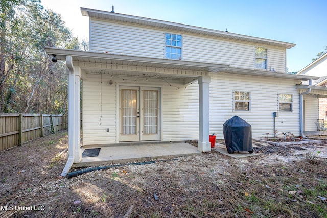 rear view of house with french doors and a patio