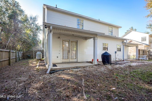 back of house featuring a patio area and french doors