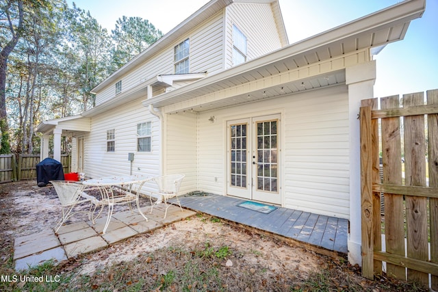 rear view of house with french doors and a patio