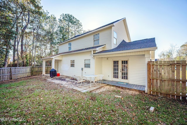 rear view of property with a patio and french doors