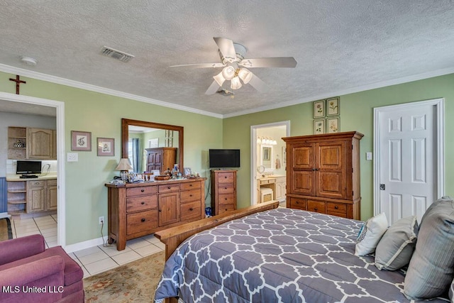 bedroom with light tile patterned floors, ensuite bathroom, ceiling fan, a textured ceiling, and crown molding