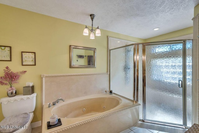 bathroom with plus walk in shower, tile patterned floors, and a textured ceiling