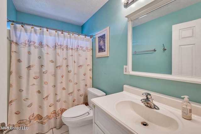 bathroom featuring a textured ceiling, toilet, a shower with curtain, and vanity