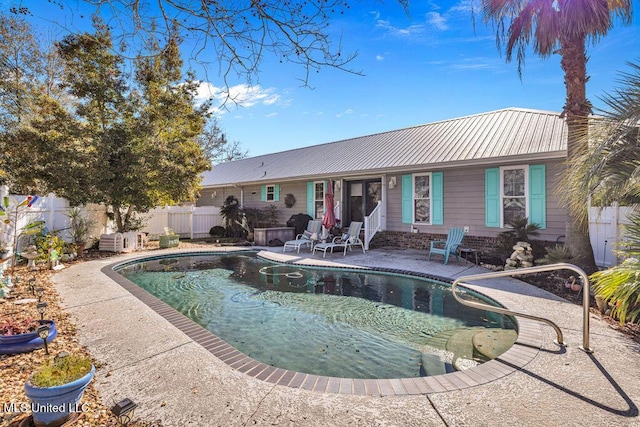 view of swimming pool with a patio area