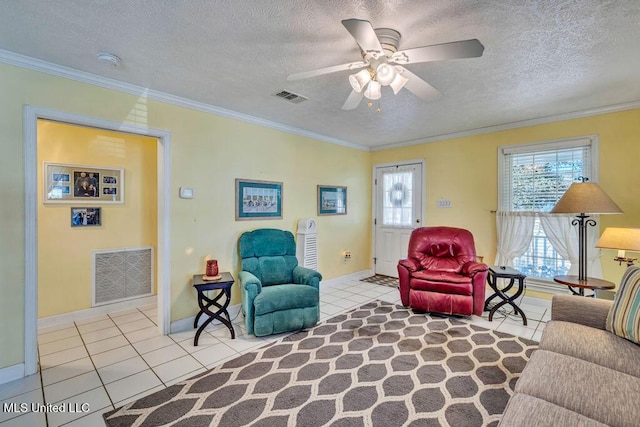 tiled living room featuring ceiling fan, crown molding, and a textured ceiling