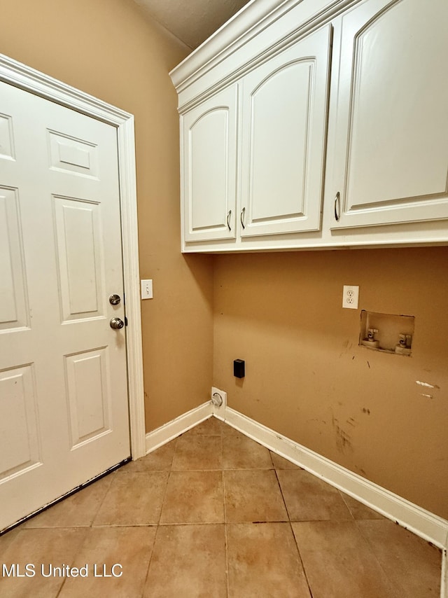 302 Bedford Ct, Brandon, MS 39047 - laundry area with cabinet space, washer hookup, light tile patterned flooring, baseboards, and electric dryer hookup