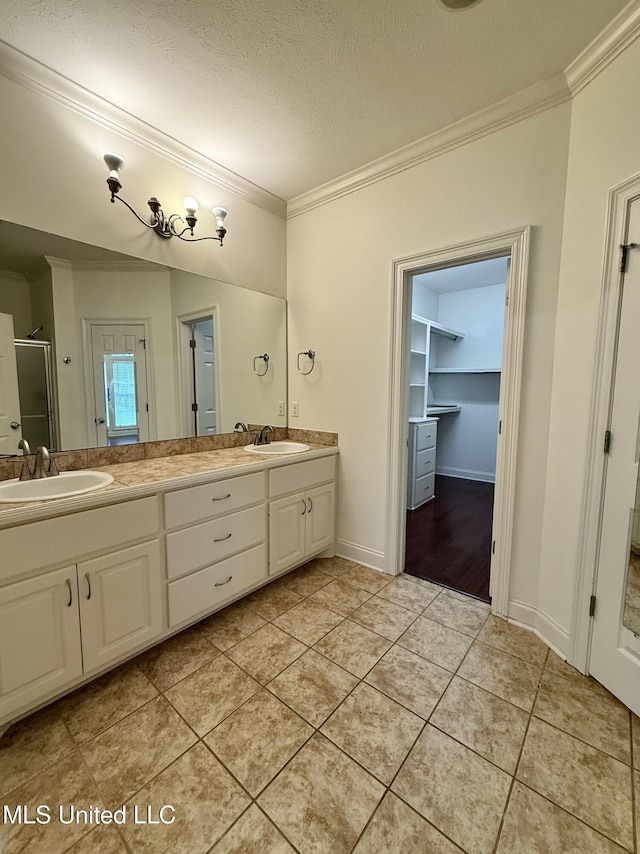 302 Bedford Ct, Brandon, MS 39047 - bathroom with crown molding, double vanity, a stall shower, tile patterned floors, and a textured ceiling