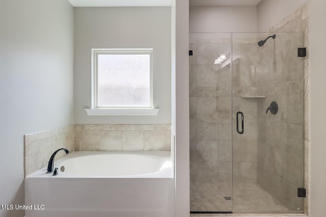 bathroom with shower with separate bathtub