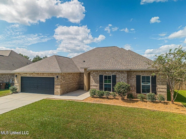 view of front facade with a garage and a front lawn