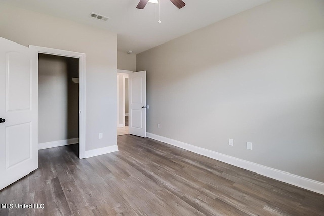 unfurnished bedroom with wood-type flooring and ceiling fan