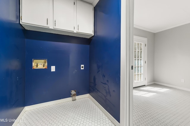 washroom featuring cabinet space, baseboards, crown molding, hookup for an electric dryer, and washer hookup