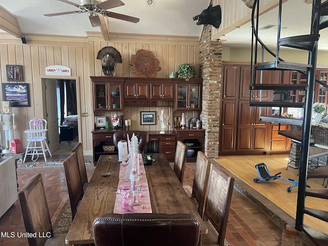 5 Lombardy Rd, Drew, MS 38737 - dining room with ceiling fan, a textured ceiling, and wood walls