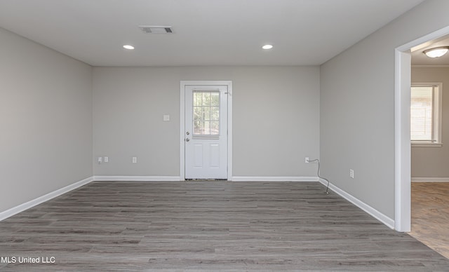 spare room with hardwood / wood-style floors