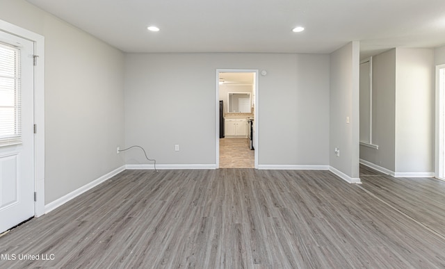 spare room featuring light wood-type flooring