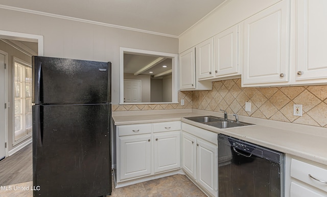 kitchen featuring white cabinetry, sink, beamed ceiling, crown molding, and black appliances