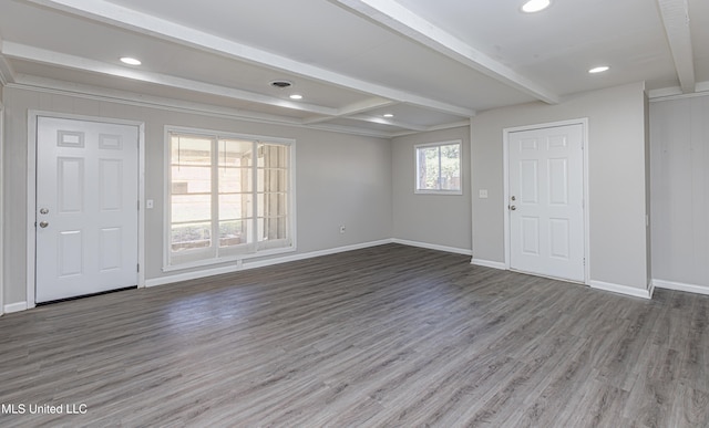 interior space with beamed ceiling and hardwood / wood-style flooring