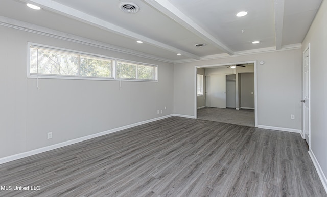 unfurnished room with beam ceiling, ceiling fan, and dark wood-type flooring