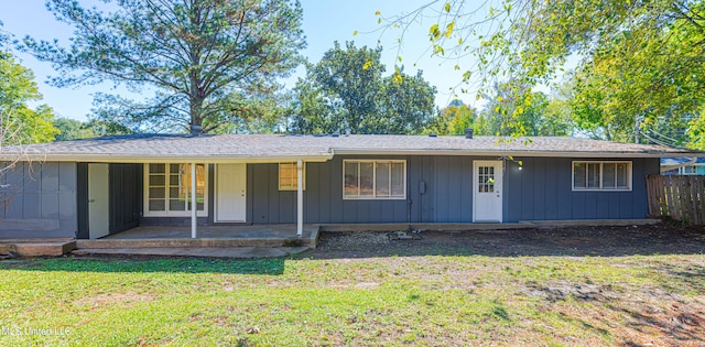 single story home with a patio and a front lawn