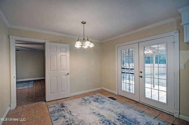 unfurnished dining area featuring ornamental molding, an inviting chandelier, and french doors