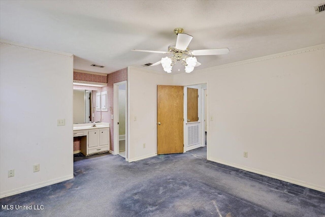634 Twin Harbor Pl, Madison, MS 39110 - unfurnished bedroom featuring dark colored carpet, baseboards, ensuite bath, ornamental molding, and ceiling fan