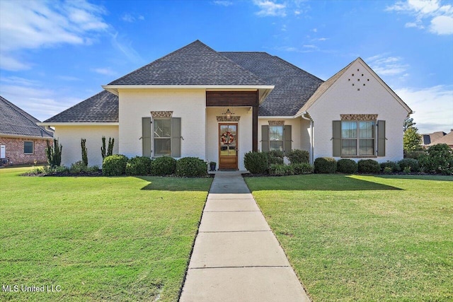 view of front of home with a front lawn