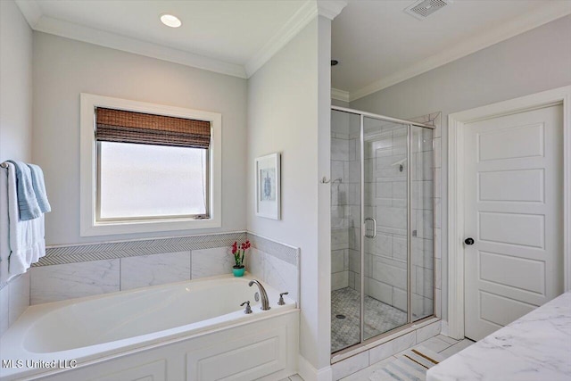 bathroom featuring crown molding and separate shower and tub