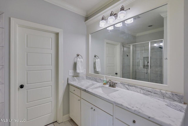 bathroom with crown molding, vanity, and a shower with shower door