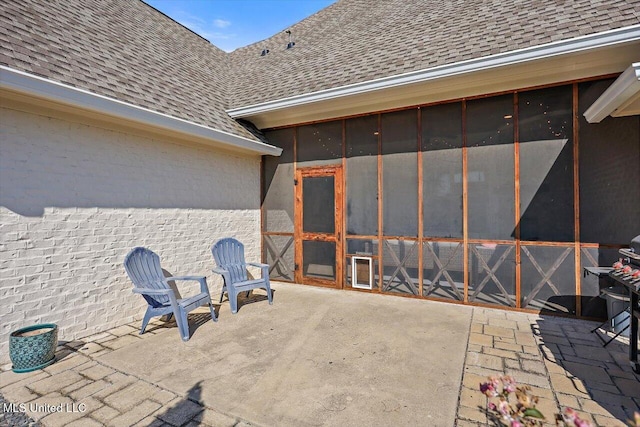 view of patio / terrace with a sunroom