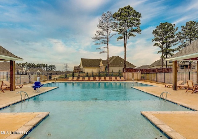 view of swimming pool featuring a patio area