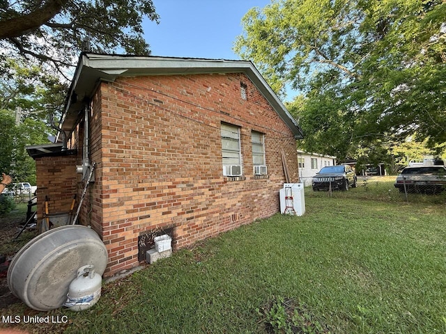 519 Copp St, Biloxi, MS 39530 - view of side of home featuring a lawn and brick siding