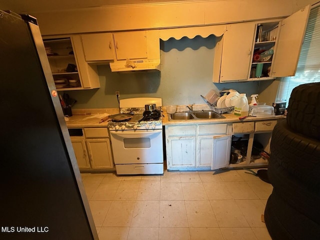 519 Copp St, Biloxi, MS 39530 - kitchen featuring open shelves, a sink, light countertops, white range with gas stovetop, and under cabinet range hood