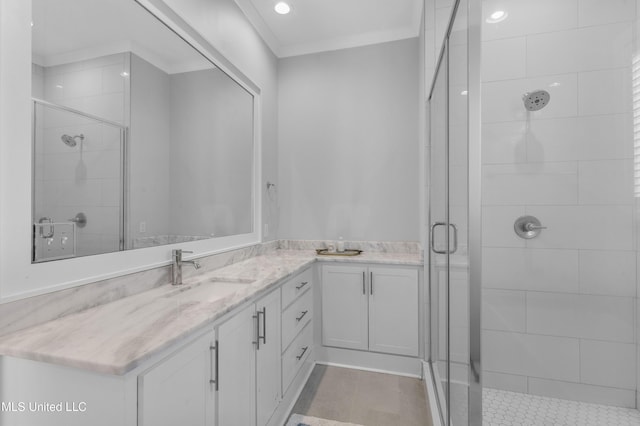 bathroom featuring vanity, walk in shower, and ornamental molding