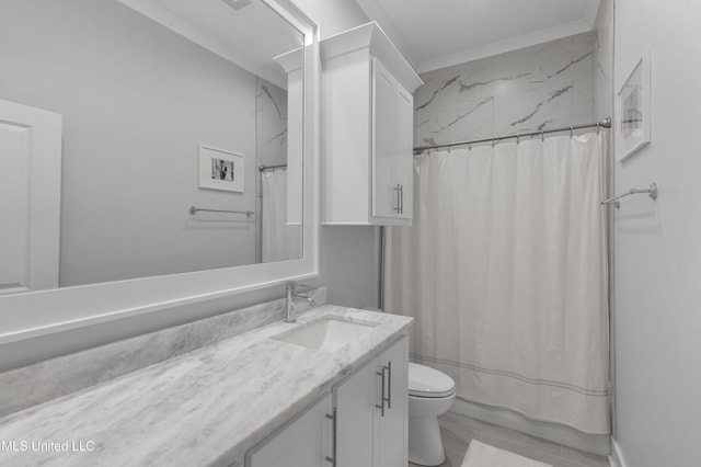 bathroom with toilet, vanity, a shower with shower curtain, and ornamental molding