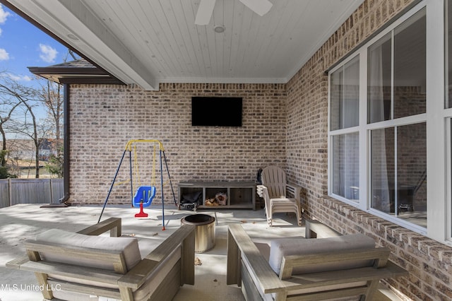 view of patio featuring ceiling fan