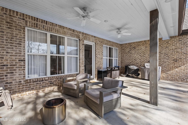 view of patio with outdoor lounge area, ceiling fan, and grilling area