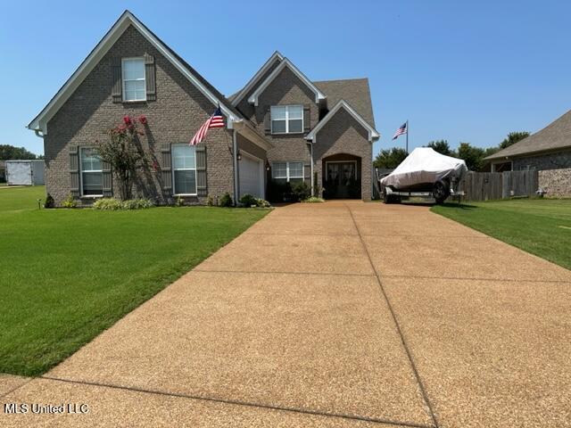 view of front of home with a front lawn