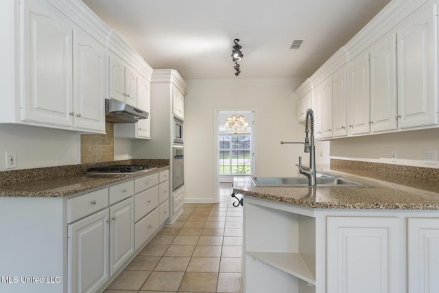 52 Eastgate Dr, Brandon, MS 39042 - kitchen with open shelves, under cabinet range hood, stainless steel appliances, light tile patterned floors, and white cabinetry