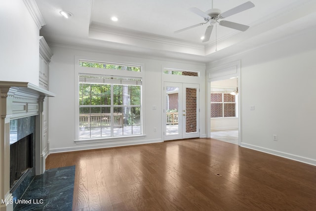 52 Eastgate Dr, Brandon, MS 39042 - unfurnished living room with a raised ceiling, a premium fireplace, a ceiling fan, wood finished floors, and crown molding