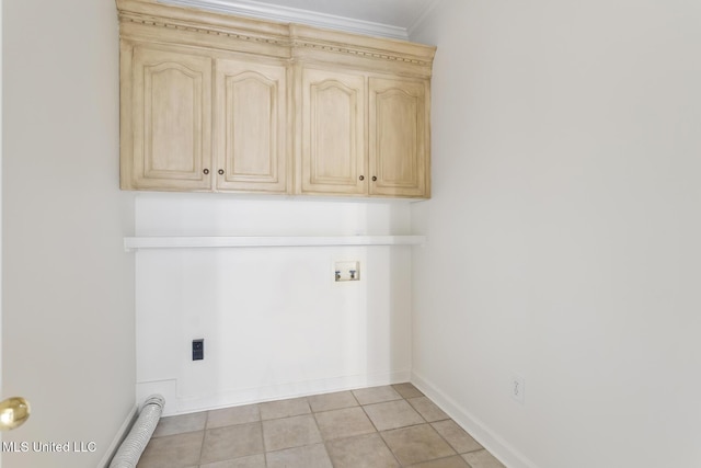 52 Eastgate Dr, Brandon, MS 39042 - laundry area featuring ornamental molding, cabinet space, hookup for an electric dryer, light tile patterned floors, and hookup for a washing machine