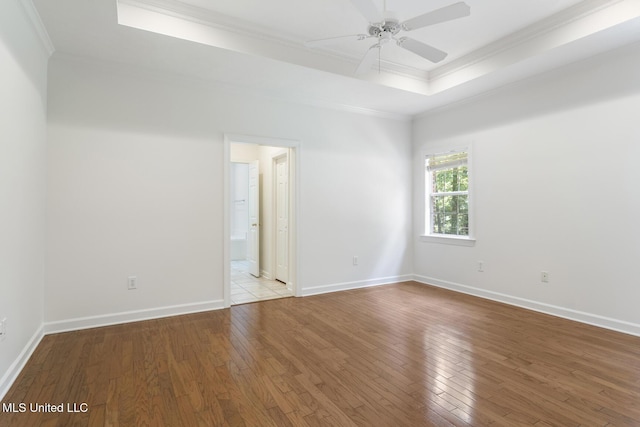 52 Eastgate Dr, Brandon, MS 39042 - unfurnished room with crown molding, hardwood / wood-style flooring, a ceiling fan, and a tray ceiling