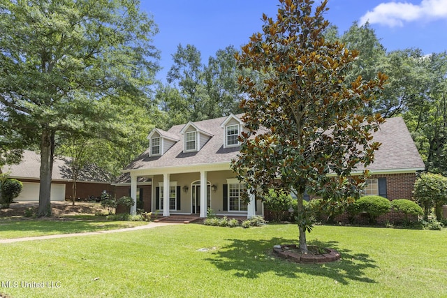 52 Eastgate Dr, Brandon, MS 39042 - cape cod-style house featuring a front lawn, covered porch, a shingled roof, and brick siding