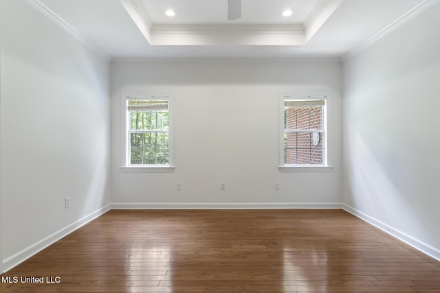 52 Eastgate Dr, Brandon, MS 39042 - empty room with dark wood-style floors, crown molding, a raised ceiling, and a ceiling fan