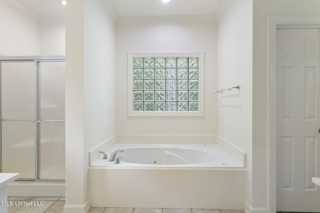 52 Eastgate Dr, Brandon, MS 39042 - full bath featuring a jetted tub, a stall shower, tile patterned flooring, and crown molding