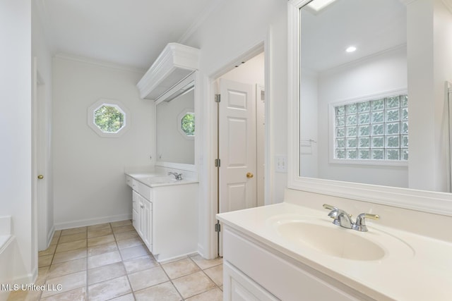 52 Eastgate Dr, Brandon, MS 39042 - full bath featuring two vanities, plenty of natural light, crown molding, and tile patterned flooring