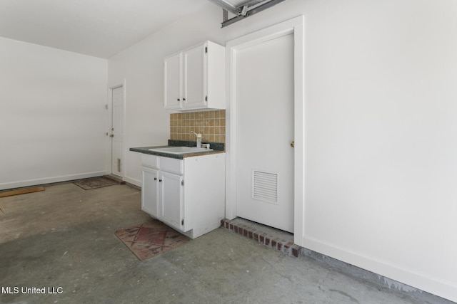52 Eastgate Dr, Brandon, MS 39042 - laundry area featuring a sink and a garage